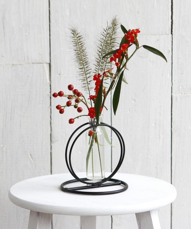 glass vase with flower and metal base