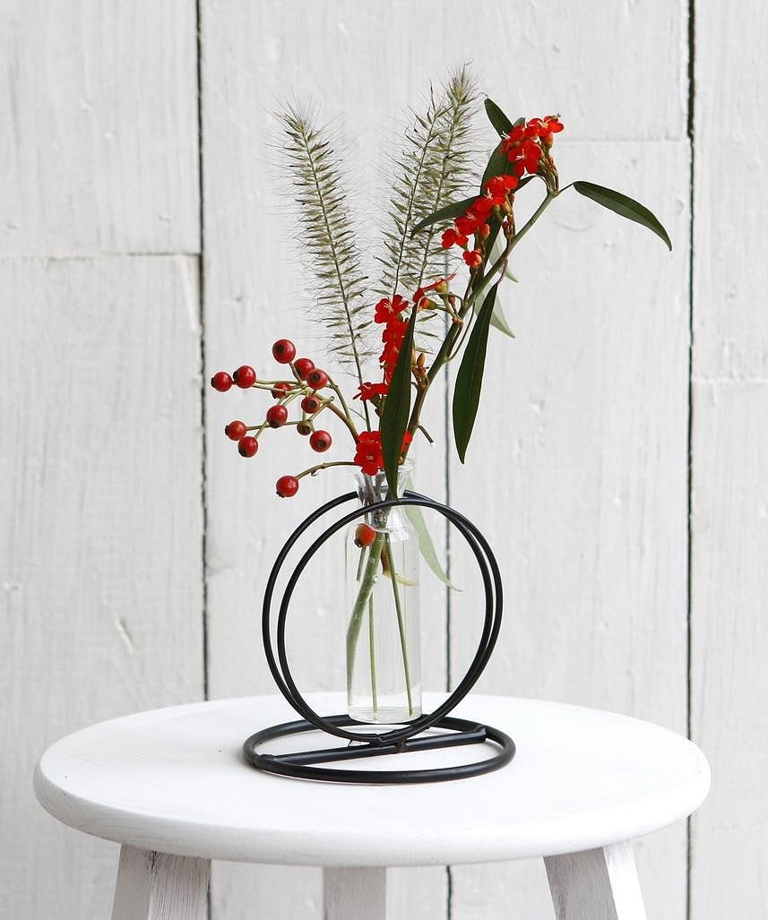 glass vase with flower and metal base